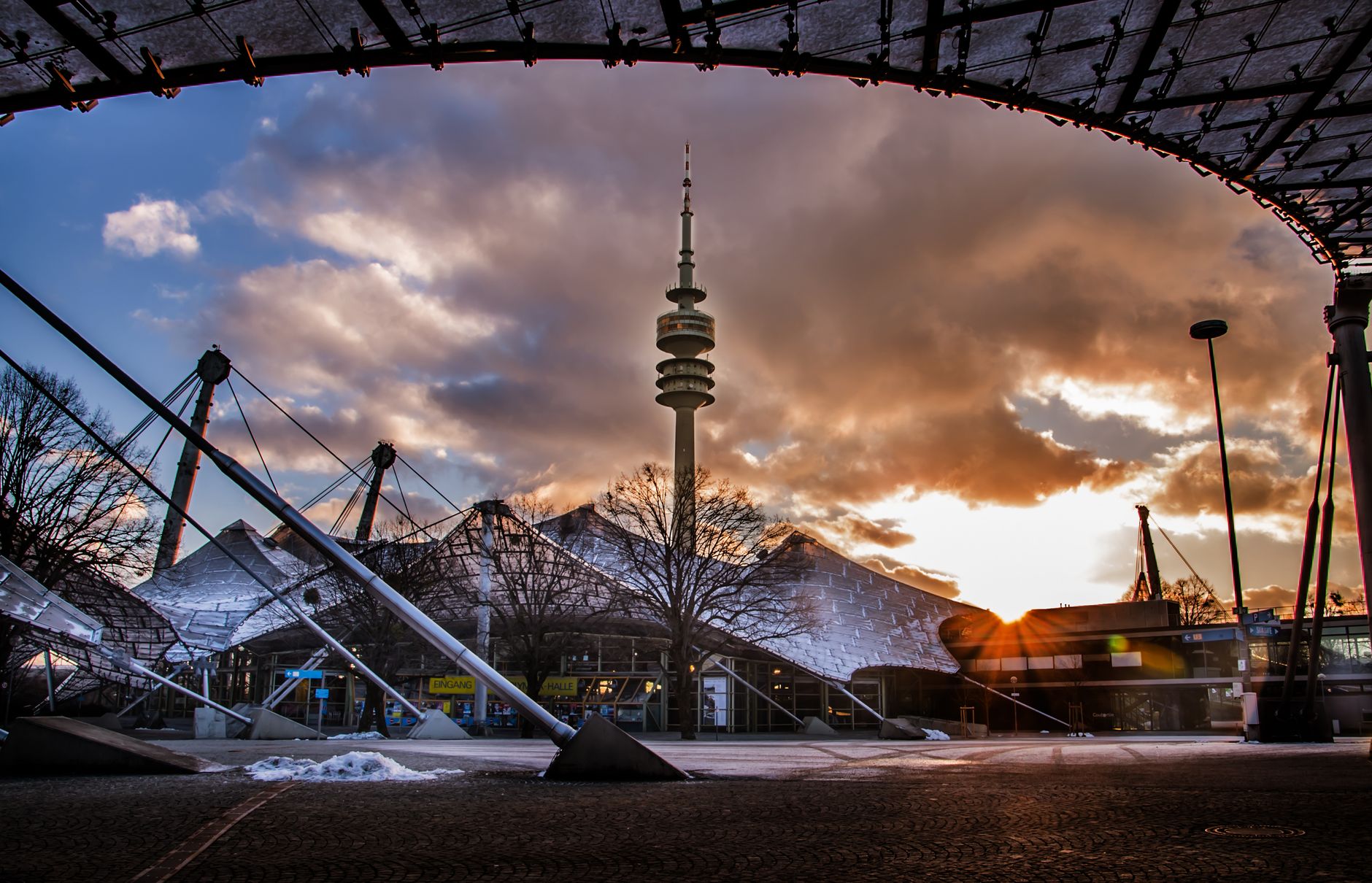 Stunning sunrise over the Munich Olympic Stadium and Tower, showcasing its iconic architecture.